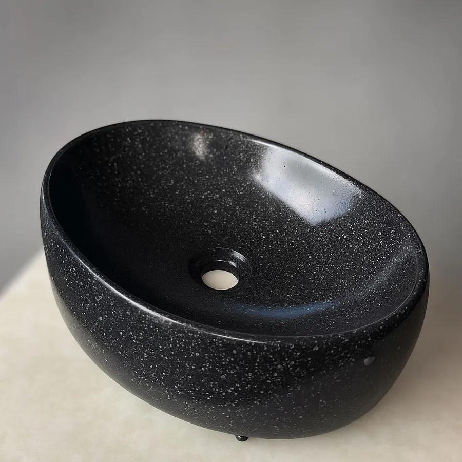 Black speckled concrete sink finish