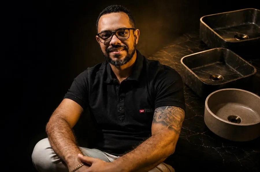 Rafael alongside different concrete sinks