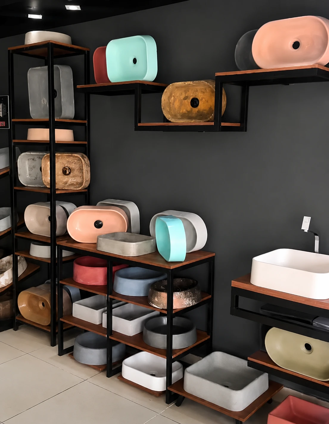Showroom display of colored concrete sinks